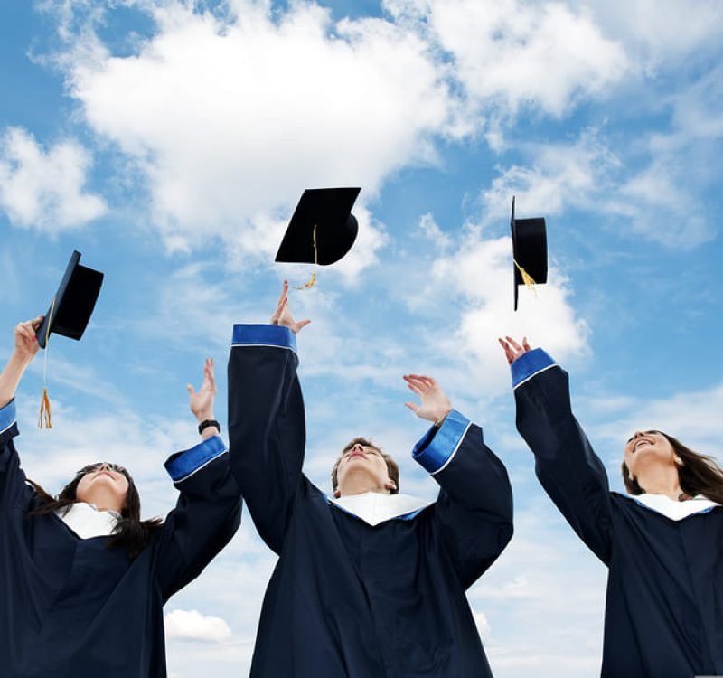 bigstock-three-graduate-students-tossin-18988985-1.jpg